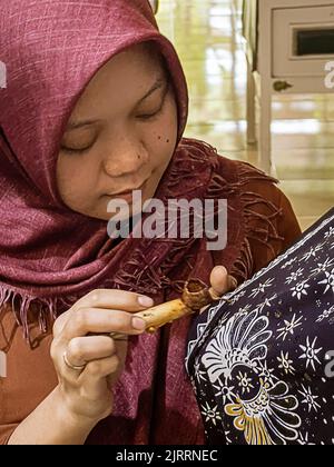 Indonesia, June 13 2022 - Batik originated in Java and is a technique of wax-resistant dye applied to the entire cloth.. Stock Photo