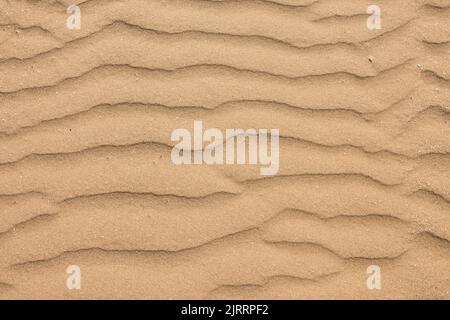 Ripple pattern in the sand caused by the receding tide Stock Photo
