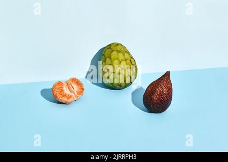 Sugar-apple, fruit of Annona squamosa cherimoya and Salacca and mandarin Stock Photo