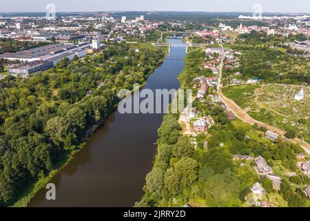 aerial view of huge bridge between two banks and urban areas Stock Photo