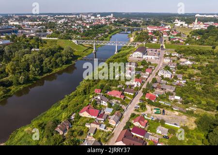 aerial view of huge bridge between two banks and urban areas Stock Photo