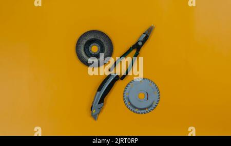 Percent symbol made up of construction tools. Background of bright yellow. Place for text or logo. Stock Photo