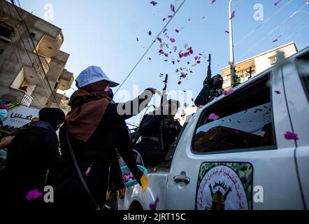 Rafah, Gaza Strip, Palestine. 24th Aug, 2022. Gaza Strip, Palestine. August 24, 2022. Fighters of the Al-Quds Brigades, the military wing of Islamic Jihad, hold a military parade in Rafah, in the southern Gaza Strip. A ceasefire between Israel and Islamic Jihad brokered by Egypt ended on 7th August, after three days of Israeli airstrikes on the Gaza Strip against the Islamic Jihad group, who retaliated by firing rockets into Israel (Credit Image: © Yousef Mohammed/IMAGESLIVE via ZUMA Press Wire) Stock Photo