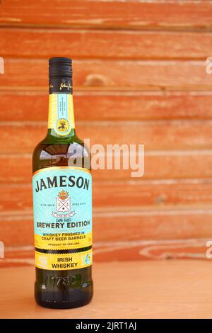 Bottle of Jameson Whiskey with wooden background Stock Photo