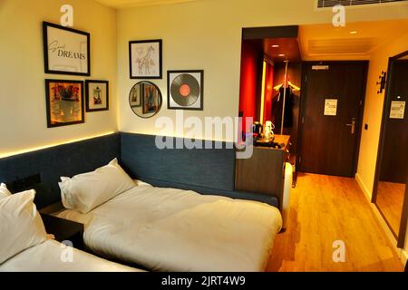 Twin bedroom at the Hampton By Hilton Ashford International, Kent, United Kingdom Stock Photo