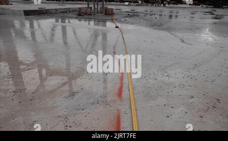 Cement floor at construction site. Abstract grungy gray floor interior backdrop for design art work. Stock Photo