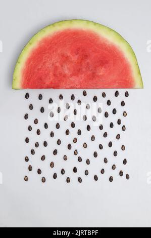 Abstract Watermelon Slice With Seeds Raining Stock Photo