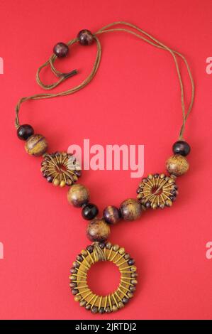 Handmade Wood Collar Necklace on a Colored Background Stock Photo