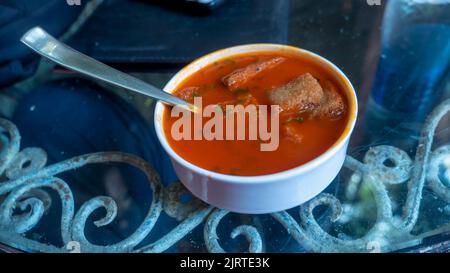 Tomato soup with toast pieces. Stock Photo