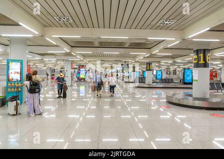 Palma de Mallorca, Spain - June 17, 2022: people pick up the baggage at Palma de Mallorca airport. Stock Photo