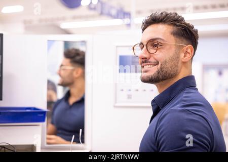 EDITORIAL USE ONLY Love Island winner Davide Sanclimenti visits Boots Opticians in Manchester Market Street to receive an eye test new designer glasses and a pair of prescription sunglasses as part of