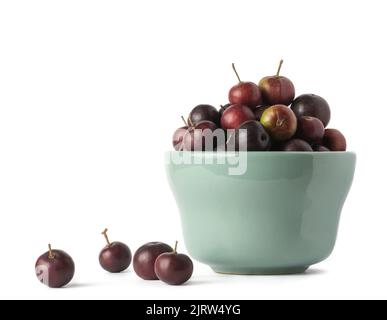 cup of governor's plum fruits, flacourtia indica, also known as ramontchi, madagascar plum or indian plum, reddish black fleshy fruits isolated Stock Photo