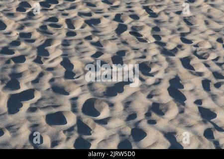 Wet Sand Undulations at Low Tide, Wavy Sand Textures, Natural Art Stock Photo