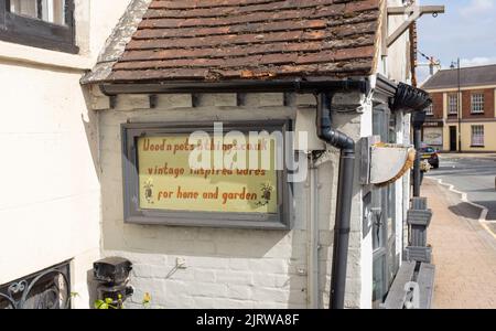 Quirky shop sign in Storrington a small town in the Horsham District of West Sussex, England Stock Photo