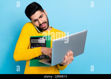 Photo of handsome busy guy dressed yellow pullover working modern gadgets prepare signing contract isolated blue color background Stock Photo