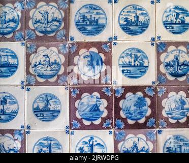 Individually hand painted wall tiles in the King's toilet at the Rosenborg Slot Copenhagen Denmark with a single tile placed wrongly Stock Photo
