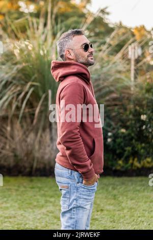 Side view of a handsome man in a hoodie Stock Photo