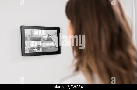 woman having video control from tablet pc at home Stock Photo