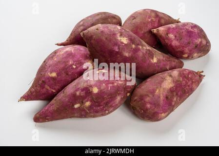 Sweet potatoes isolated on white background. Stock Photo