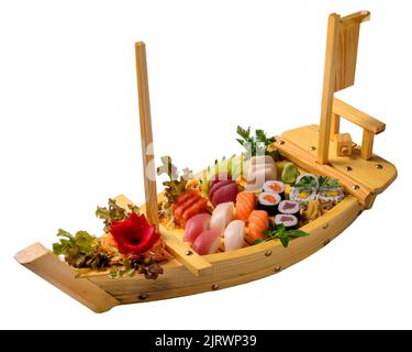 Japanese food mix including sushi and sashimi on wooden barge. Stock Photo