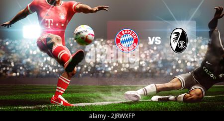 Guilherand-Granges, France - August 26, 2022. Bundesliga of Germany. Football soccer players slide tackle for possession of the ball. Bayern Munich vs Stock Photo