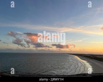 An aerial view of  Port Canaveral at sunset during a cruise ship sail away in Florida. Stock Photo