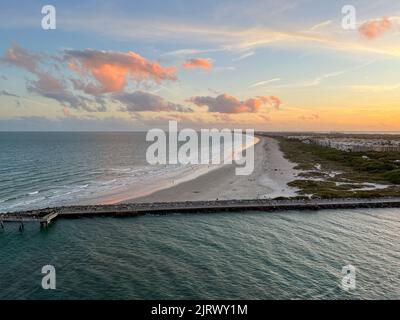 An aerial view of  Port Canaveral at sunset during a cruise ship sail away in Florida. Stock Photo