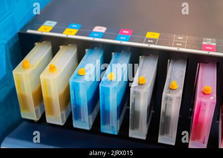 Row of inkjet printer CMYK cartridges - close up Stock Photo