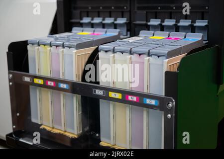 Row of inkjet printer CMYK cartridges - close up Stock Photo