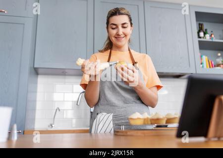 woman cooking food and baking on kitchen at home Stock Photo