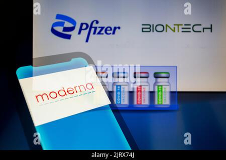 Asuncion, Paraguay. 26th Aug, 2022. Moderna logo displayed on a smartphone backdropped by visual representation of vials and Pfizer, BionTech logos. Cambridge, MA - Moderna, Inc. today announced that it is filing patent infringement lawsuits against Pfizer and BioNTech in the United States District Court for the District of Massachusetts and the Regional Court of Dusseldorf in Germany. Moderna believes that Pfizer and BioNTech's COVID-19 vaccine Comirnaty infringes patents Moderna filed between 2010 and 2016 covering Moderna's foundational mRNA technology. (Credit Image: © Andre M. Chang/ZUMA