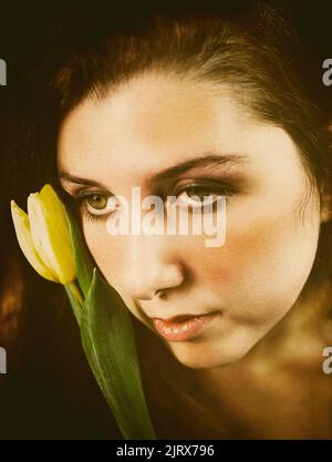 teenager with tulip in hand II Stock Photo