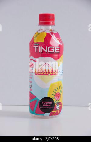 A vertical closeup shot of a delicious Tinge drink in a bottle Stock Photo