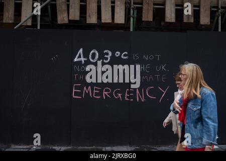 Climate crisis slogans chalked on walls in the city, in Glasgow, Scotland, 26 August 2022. Stock Photo