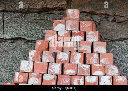 Red bricks lying on top of each other, concept of building Stock Photo