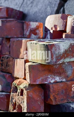 Red bricks lying on top of each other, concept of building Stock Photo