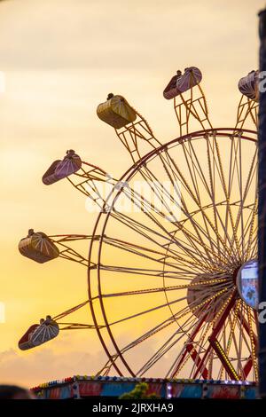 Toy giant park wheel Play City in Rio de Janeiro with a beautiful sunset background- January 12, 2019: Giant wheel of Playcity amusement park, with a Stock Photo