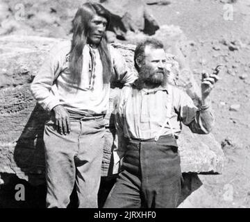 JOHN WESLEY POWEL in AL (1834-1902) American geologist  and explorer at right in Arizona about 1871 with Tau-hu, Headman of the Southern Paiute. Stock Photo