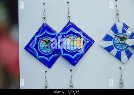 Earrings with flag of the school of Beija Flor, Rio de Janeiro, Brazil -14 July 2017: Earrings with the flag of the samba school Beija Flor de Nilópol Stock Photo