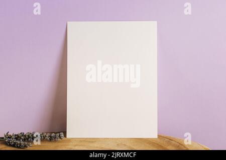Paper mock-up over pastel purple wall Stock Photo