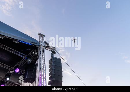 Commercial airplane flying over lasi aerodrome during Hangariada festival in Romania Stock Photo