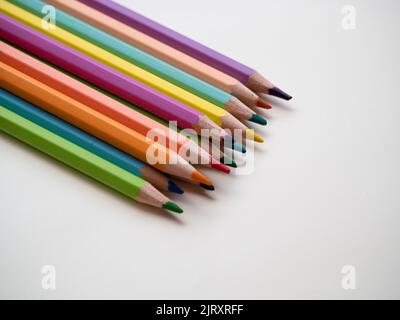Drawing supplies: assorted color pencils, isolated on white background Stock Photo