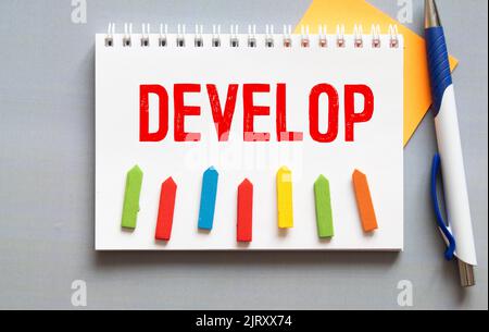 Develop word written on wood block. Develop text on cement table for your desing, concept Stock Photo