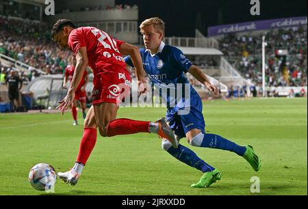 Omonia's Panagiotis Zachariou and Gent's Jens Petter pictured in action during a soccer game between Cypriot Omonia Nicosia and Belgian KAA Gent in Nicosia, Cyprus on Thursday 25 August 2022, the return leg of the play-offs for the UEFA Europa League competition. BELGA PHOTO DAVID CATRY Stock Photo