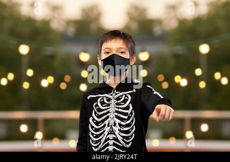 boy in mask and halloween costume of skeleton Stock Photo