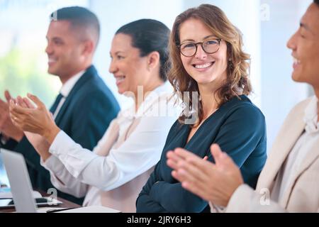 Motivation, vision and collaboration by clapping business people celebrating success, support goal in conference. Portrait happy employee excited Stock Photo