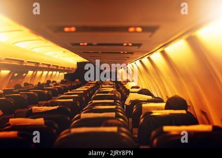 Theres a whole big world to explore out there. passenger seating inside an airplane. Stock Photo