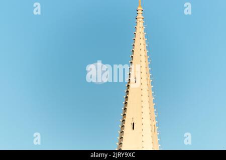 moon setting beside the tower of a church in the city of rio de janeiro brazil. Stock Photo