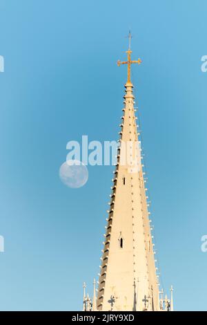 moon setting beside the tower of a church in the city of rio de janeiro brazil. Stock Photo