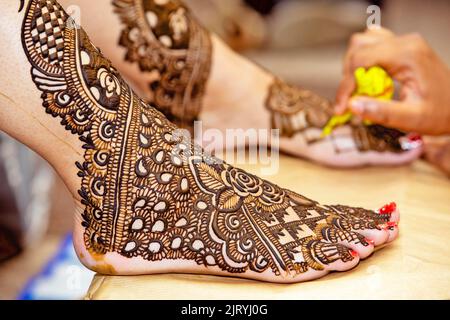 Henna design on Brides foot Stock Photo